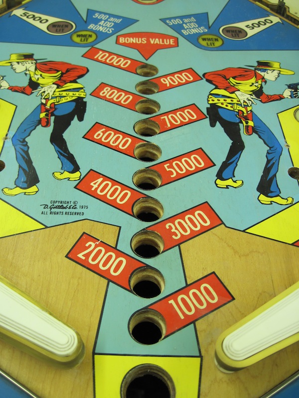 A view of the bonus counter light inset area. All of the insets have been removed. 