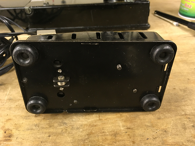 The bottom of the foot controller, showing four round, rubber feet.