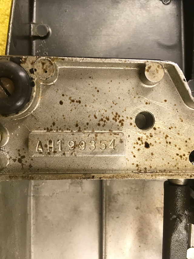 A closeup of the serial number plate, which reads "AH199354."