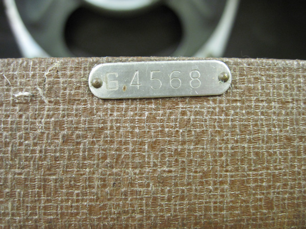 The serial number tag, which is steel and mounted to the amp with two small nails. The tag reads "G4568."